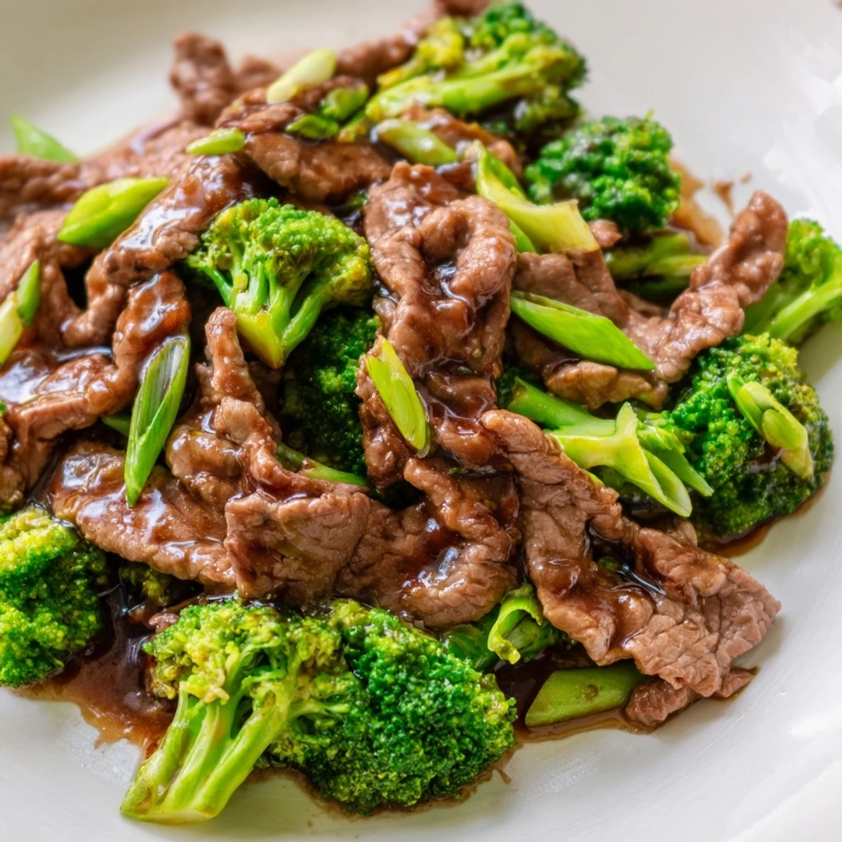 Colorful platter of tender beef and crisp broccoli florets with Beef and Broccoli Stir Fry ready to eat.