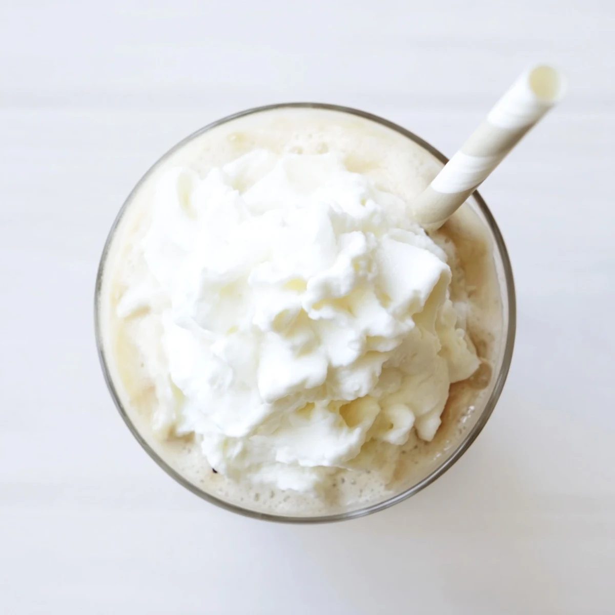 A refreshing homemade Starbucks Vanilla Bean Frappuccino with vanilla bean ice cream and ice.