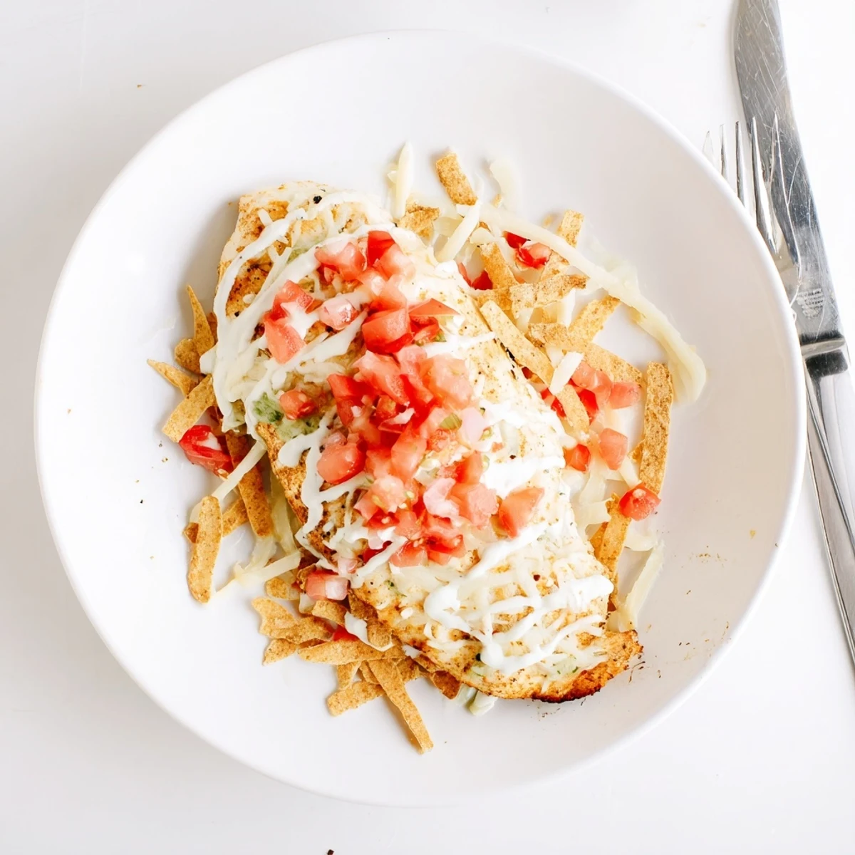 Golden-brown Fiesta Lime Chicken breasts sizzling on a grill, marinated in lime and spices, ready for toppings.