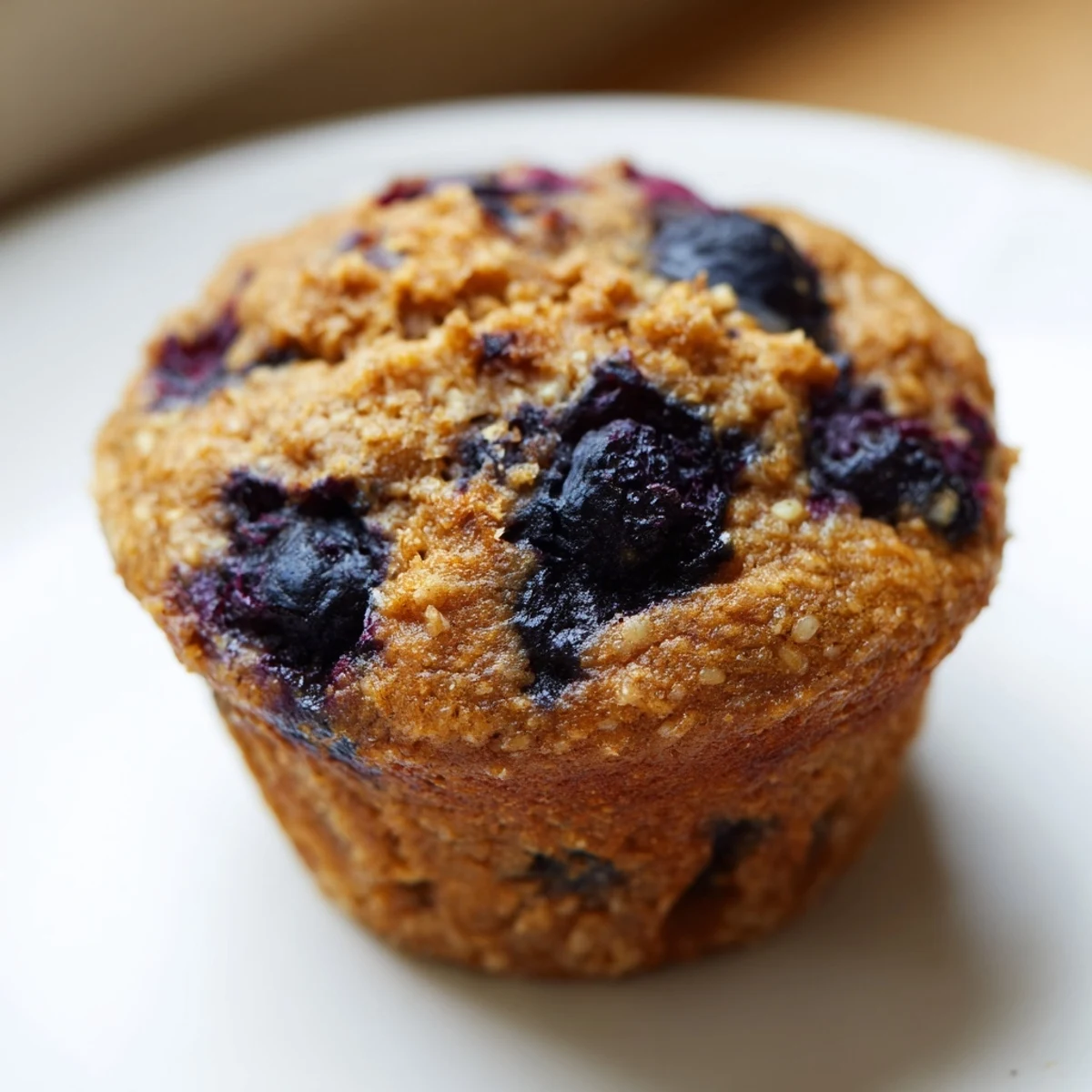 Freshly baked Greek Yogurt Blueberry Protein Muffins packed with blueberries for an on-the-go snack.  