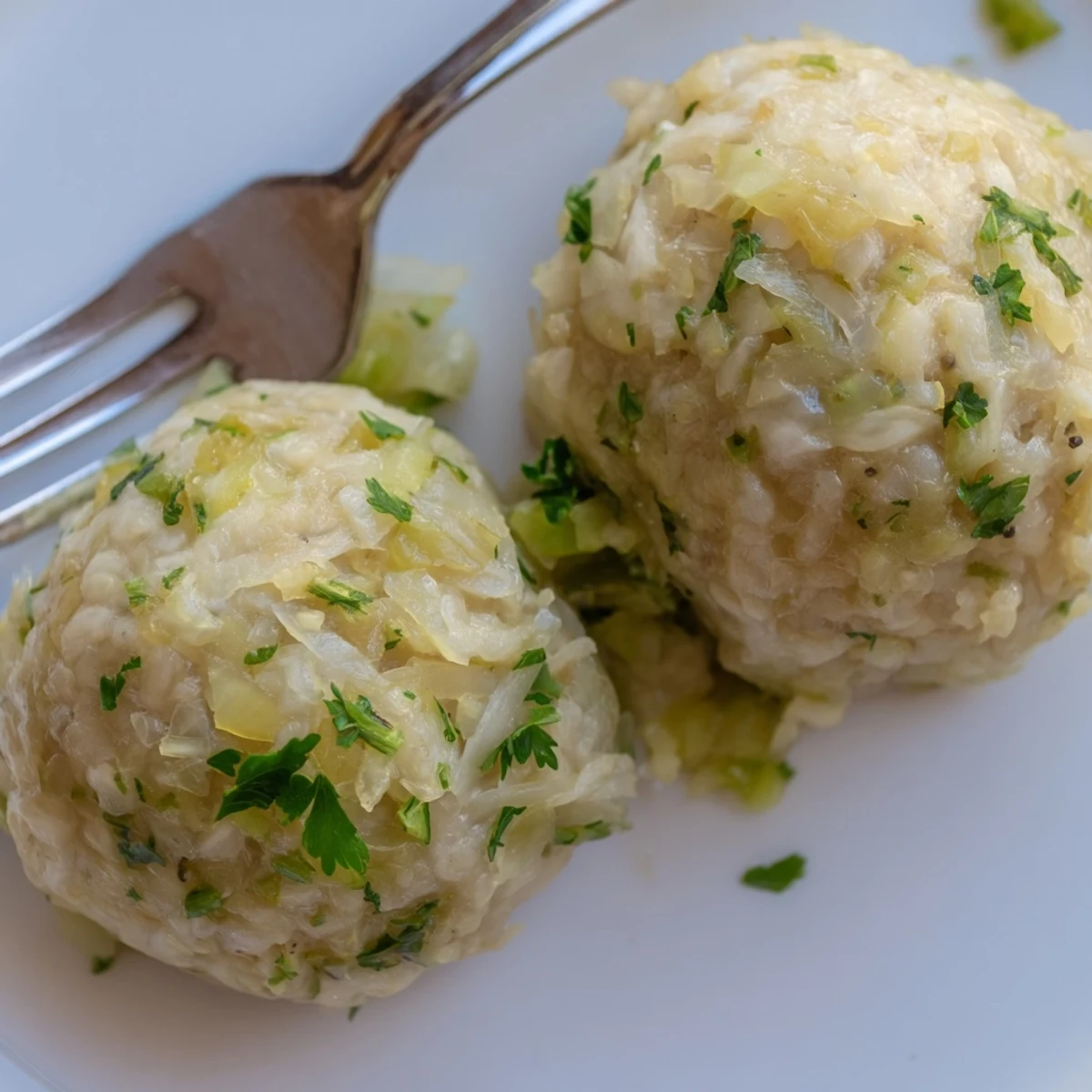 German Cabbage Dumplings served hot with melted butter and fresh herbs on the side.  
