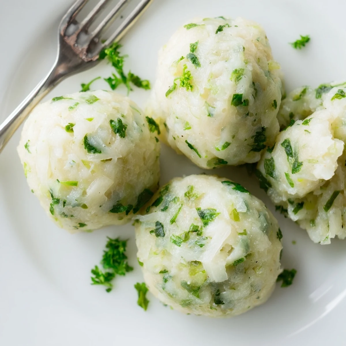 Steaming German Cabbage Dumplings in broth, ready to enjoy as a comforting vegetarian main.