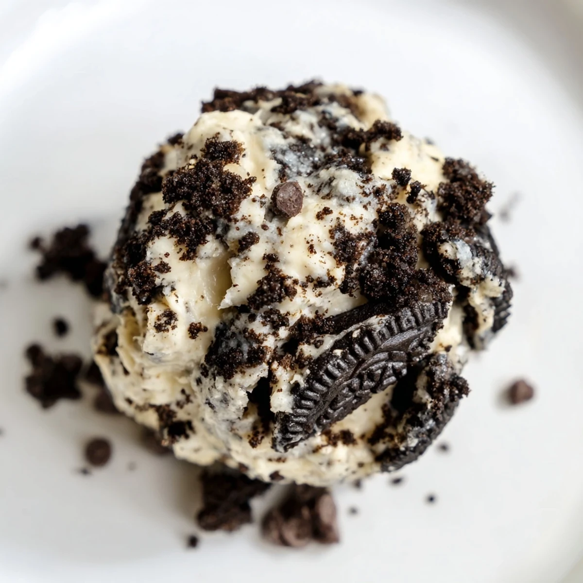No-bake cream cheese Oreo protein balls on a plate, served chilled as a post-workout snack for energy.