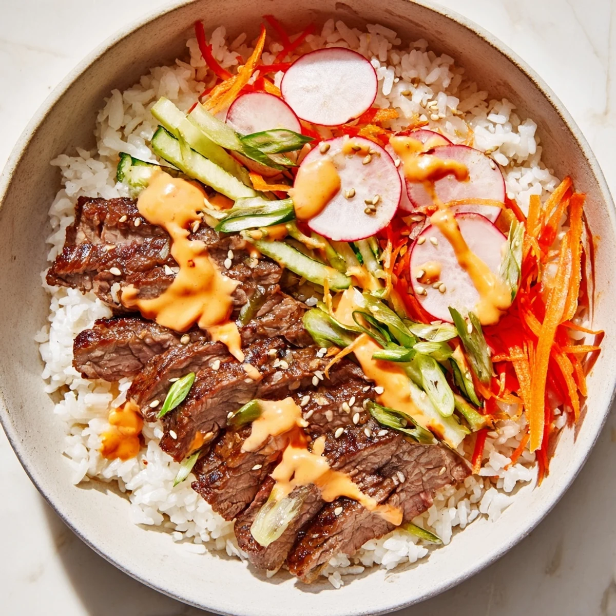 Bright serving of Irresistibly Easy Korean BBQ Steak Rice Bowls with Spicy Cream Sauce garnished with sesame seeds and herbs, ready for a satisfying weeknight family dinner.