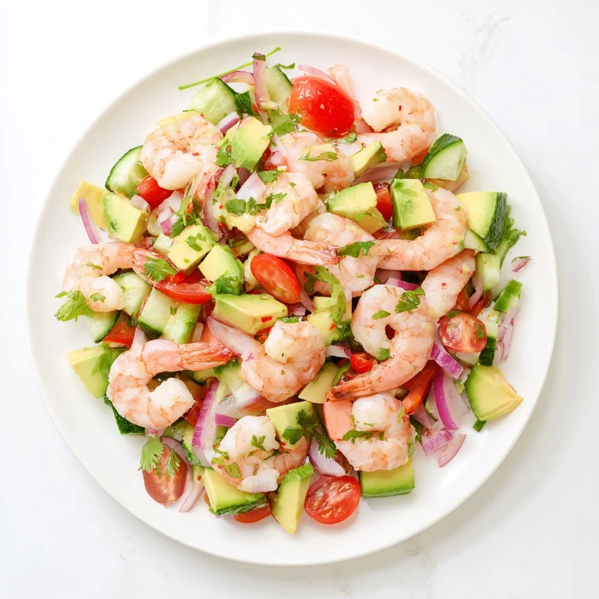 Freshly boiled, chilled shrimp mingle with diced avocado and crisp red bell pepper in a Healthy Shrimp Avocado Salad, dressed with zesty lime.