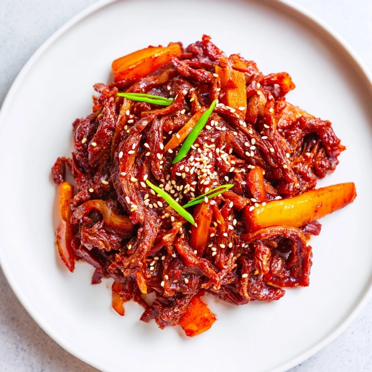 Korean Style Pot Roast in a Dutch oven, featuring meltingly tender beef and vegetables in a rich, aromatic glaze.