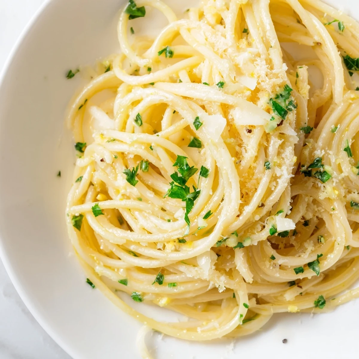Steaming plate of one pot garlic butter pasta featuring al dente noodles in rich melted garlic butter