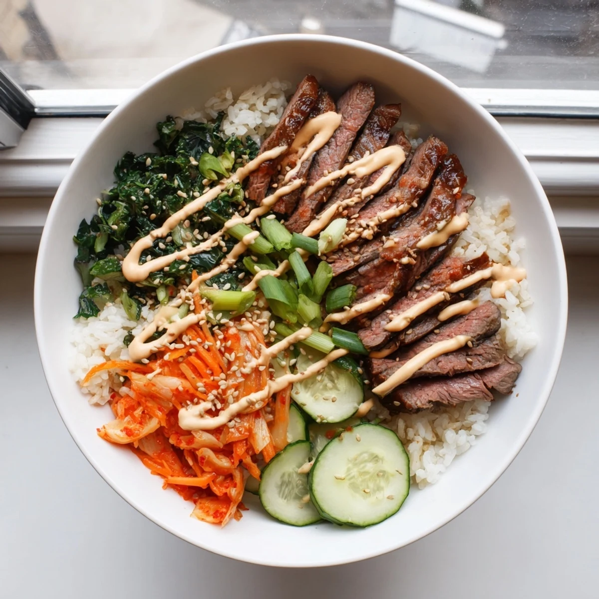 Sizzling marinated steak and crisp veggies over fluffy rice in Korean BBQ steak rice bowls