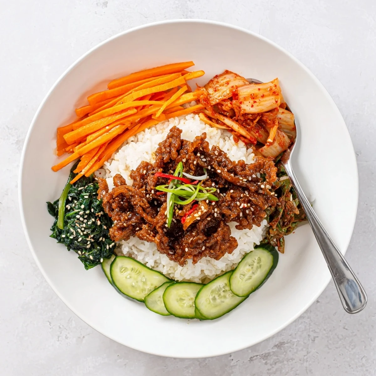 Crispy shredded tofu bulgogi bowl served over warm rice with colorful julienned vegetables