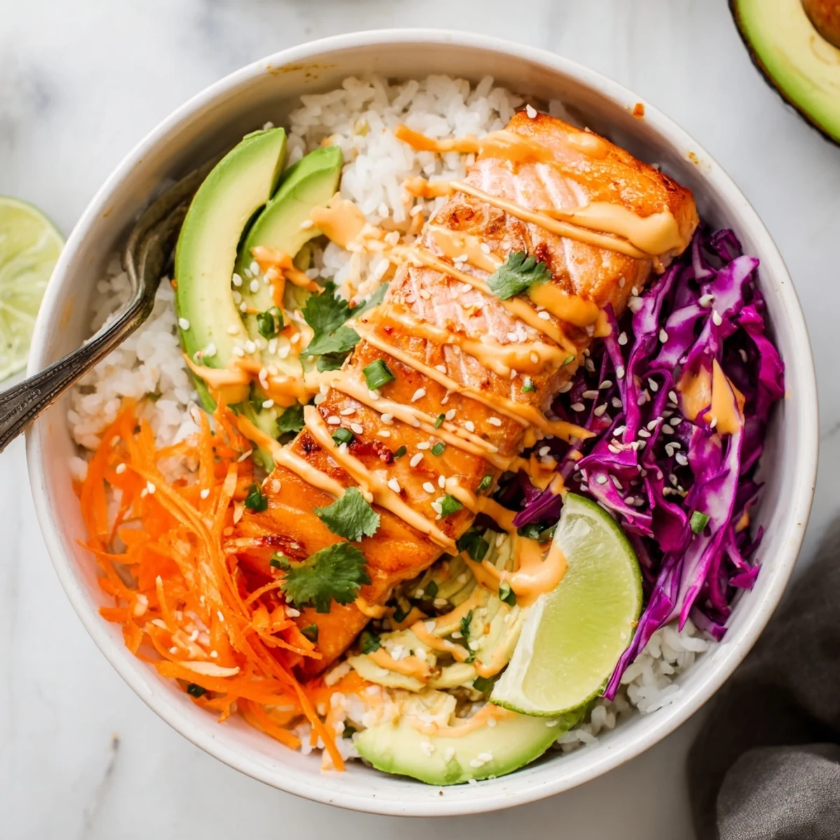 Bright Bang Bang Salmon Bowls Recipe: flaky salmon over jasmine rice, cilantro garnish