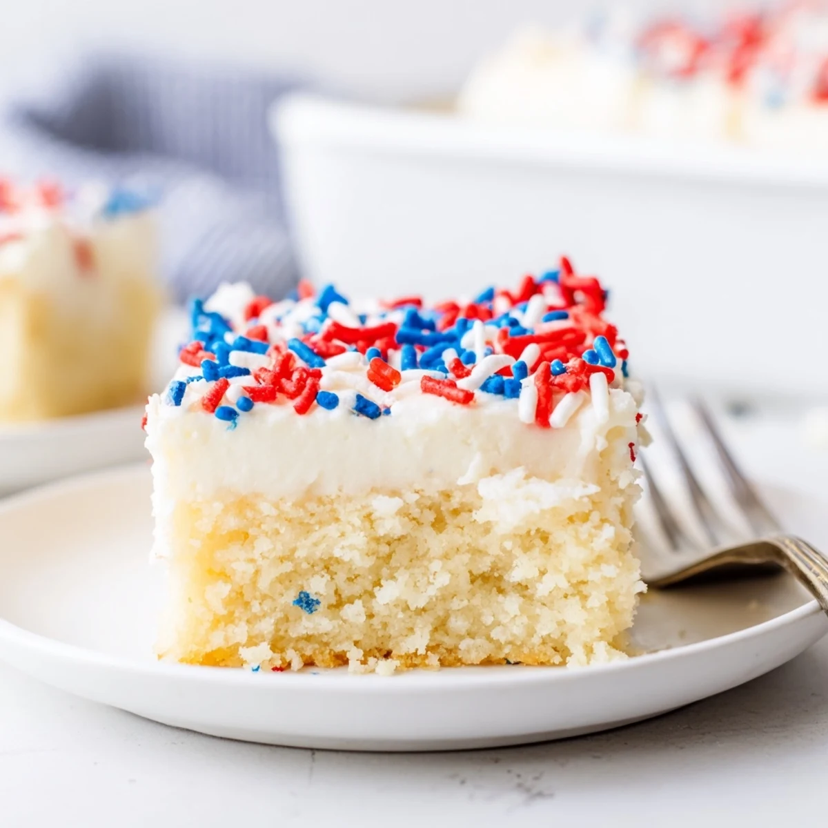 4th Of July Sugar Cookie Bars Recipe with creamy vanilla frosting and sprinkles
