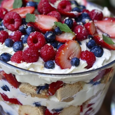 Red white blue mixed berry yum yum topped with fresh strawberries and blueberries